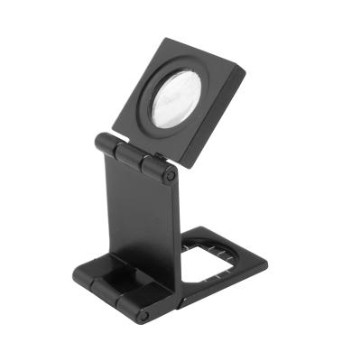 Folding magnifier with scale 7X magnification Ø15 mm lens